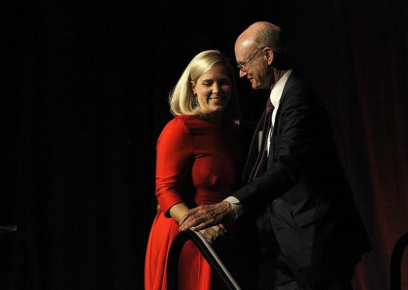 Arkansas Democrat-Gazette publisher Walter E. Hussman Jr. hugs his daughter, Eliza Hussman Gaines, as she leaves the stage during the 200th Anniversary celebration of the Arkansas Gazette on Thursday, Nov. 21, 2019, at the Statehouse Convention Center in Little Rock. Gaines is now the paper's executive editor. (Photo by Thomas Metthe/Arkansas Democrat-Gazette)